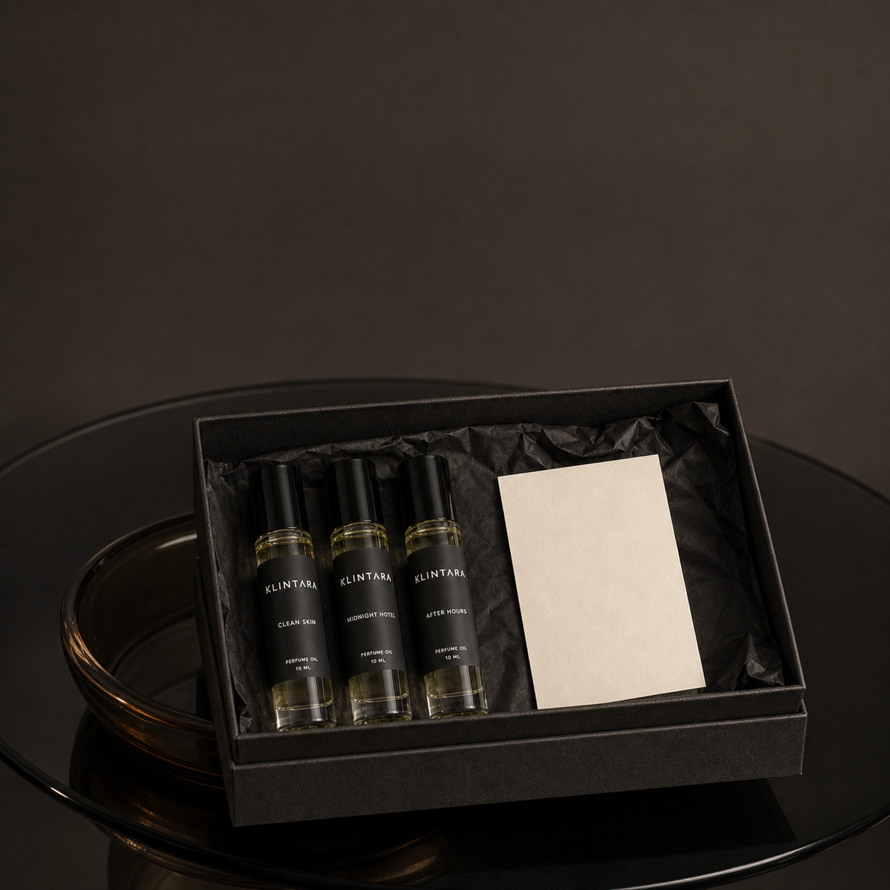 Three Klintara perfume oils in a black gift presentation box